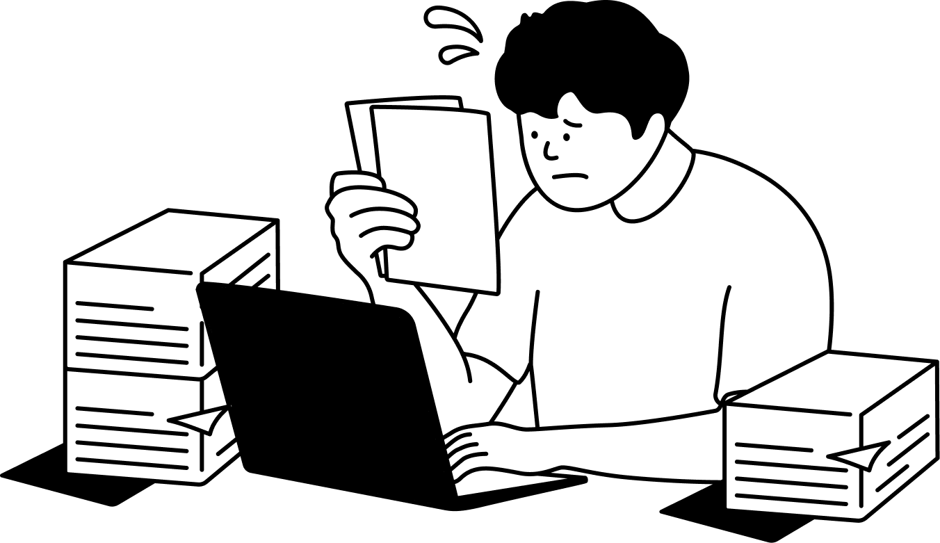 たくさんの書類を前に困っているケアマネジャー